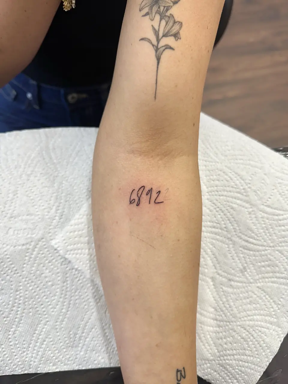 Small handwritten numerals just below the inner elbow.