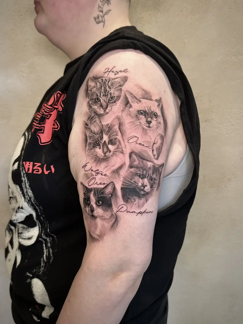Five shaded cat portraits with their names arranged down the upper arm.